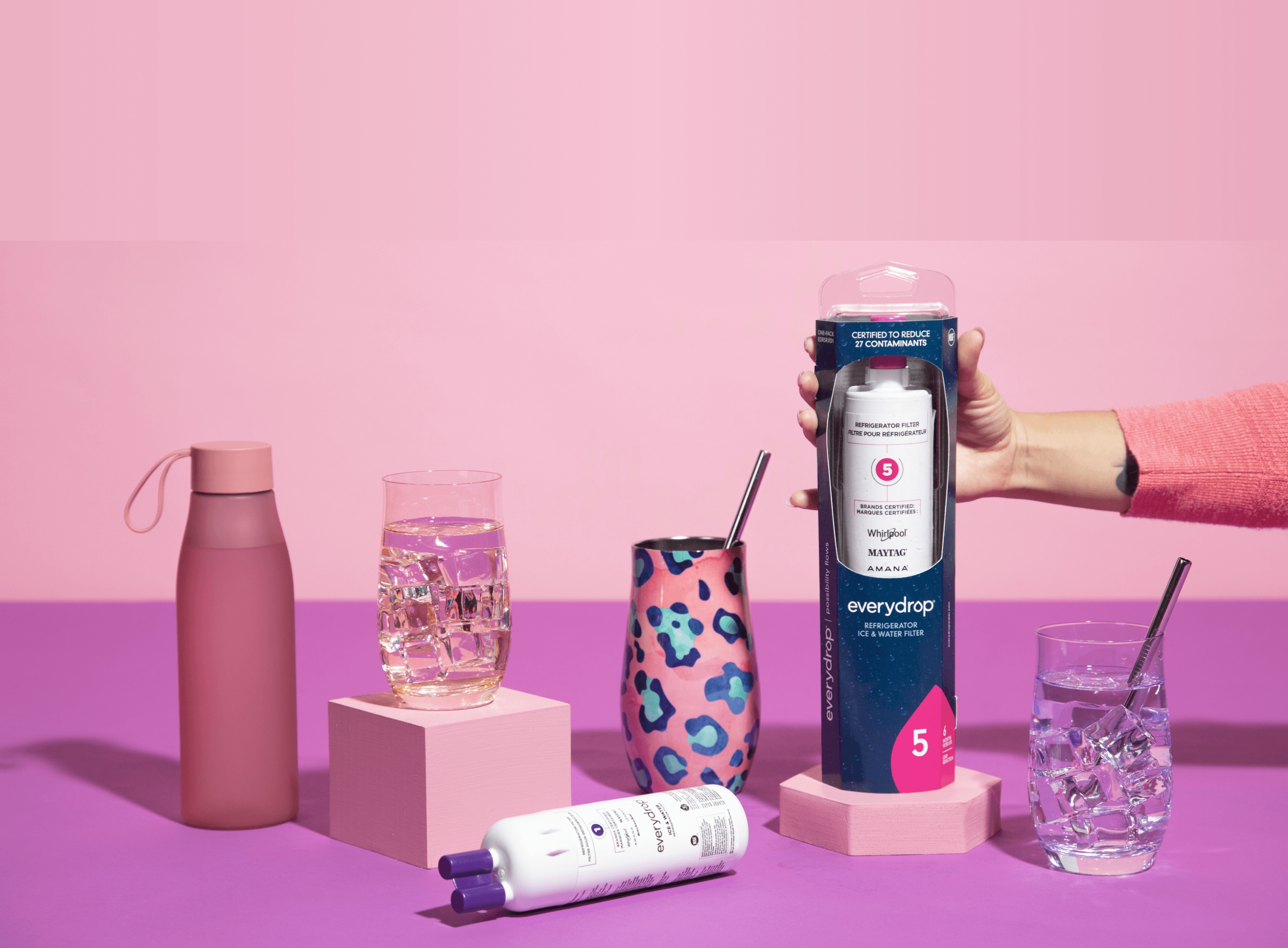 everydrop® filters arranged with colorful glasses of water and water bottles